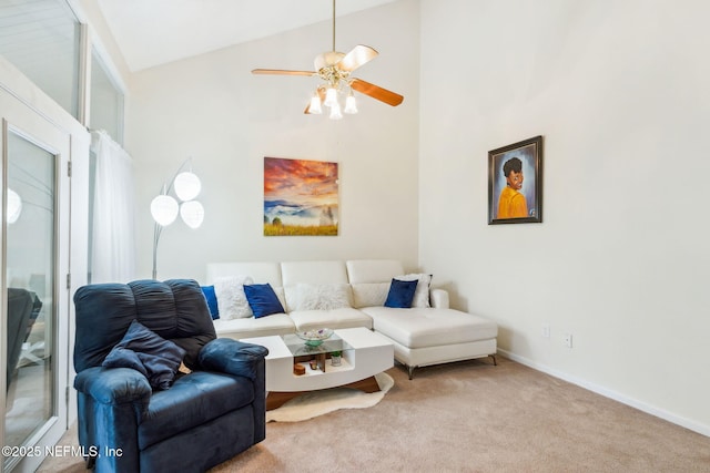 living room with high vaulted ceiling, carpet, ceiling fan, and baseboards