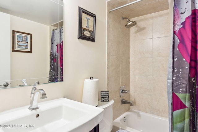 bathroom featuring toilet, shower / bathtub combination with curtain, and vanity