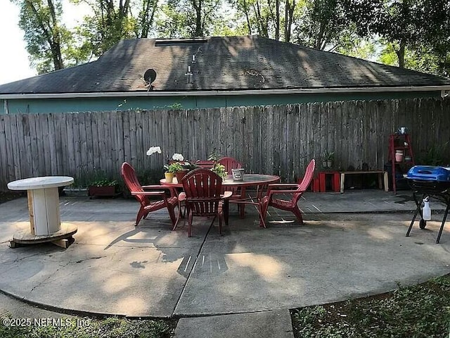 view of patio / terrace with area for grilling and fence private yard