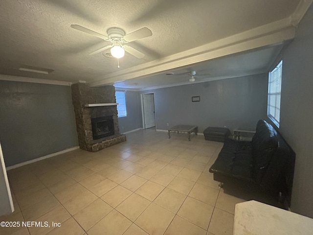 unfurnished living room with a healthy amount of sunlight, light tile patterned floors, a textured ceiling, and a ceiling fan