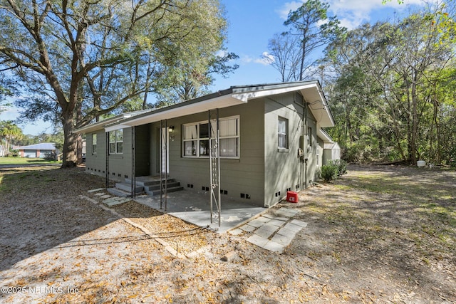 view of front of house featuring crawl space