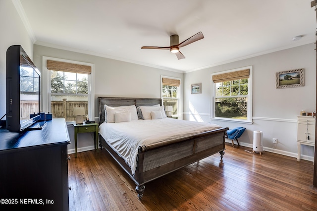 bedroom featuring hardwood / wood-style flooring, ceiling fan, baseboards, and crown molding