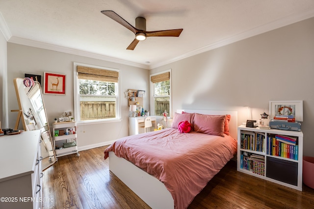 bedroom with ornamental molding, a ceiling fan, hardwood / wood-style flooring, and baseboards