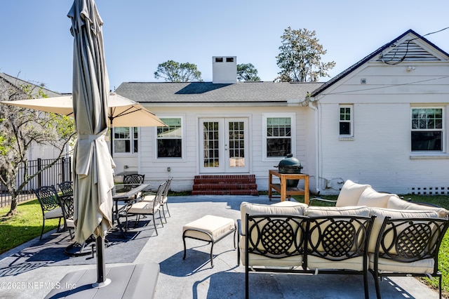 rear view of property with french doors, a chimney, an outdoor hangout area, entry steps, and fence