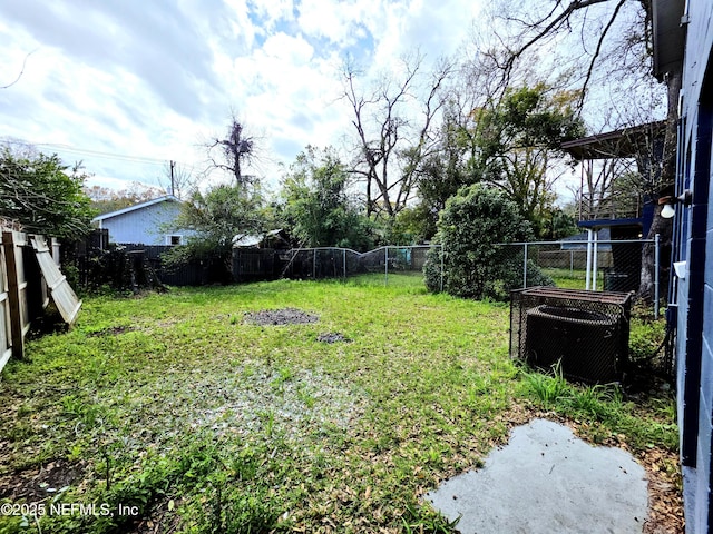 view of yard with cooling unit and a fenced backyard