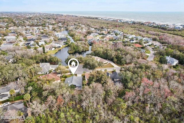 bird's eye view with a water view and a residential view