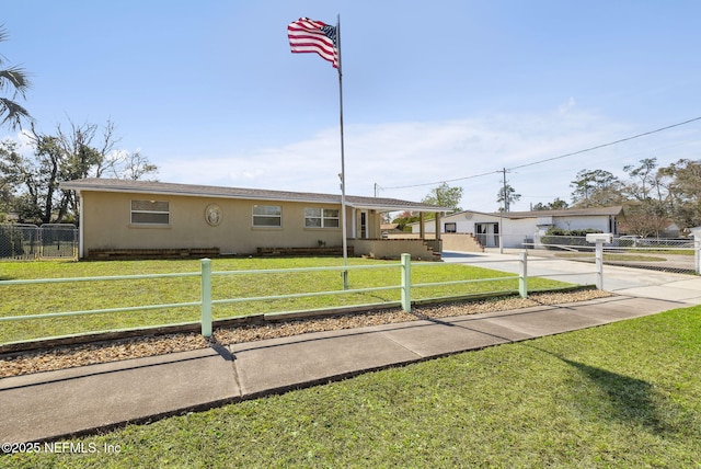 view of front of home featuring a front yard, fence, and stucco siding