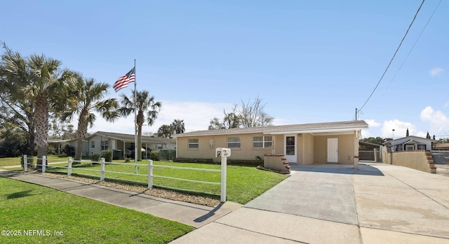 single story home featuring a front yard, fence, concrete driveway, and stucco siding