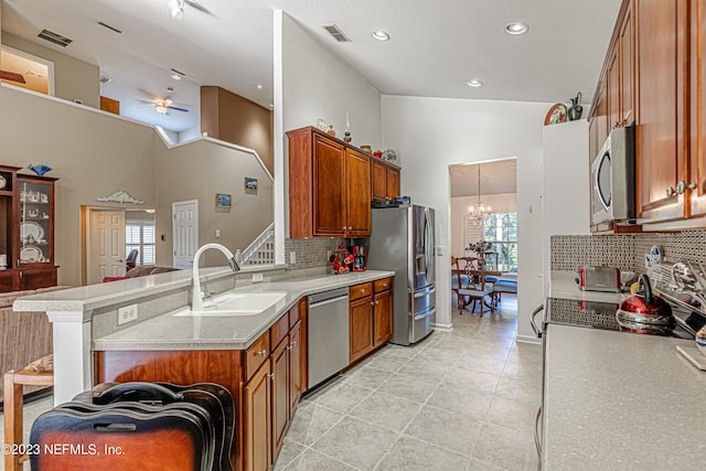kitchen with visible vents, a chandelier, light countertops, stainless steel appliances, and a sink