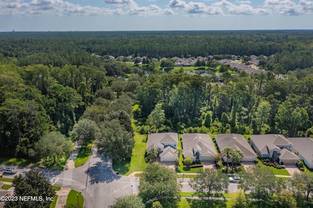 aerial view with a residential view and a view of trees