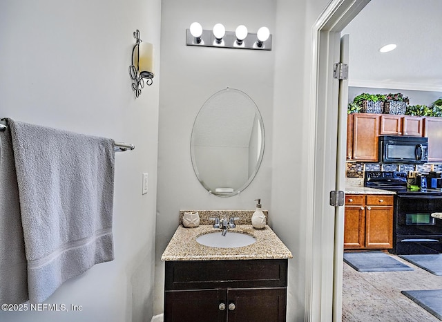 bathroom featuring tasteful backsplash and vanity