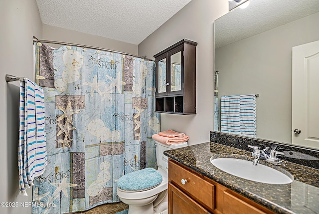 full bathroom featuring a shower with curtain, toilet, a textured ceiling, and vanity