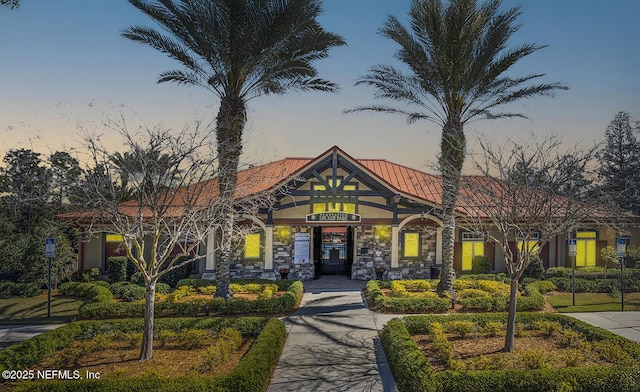 view of front of home featuring a standing seam roof and metal roof