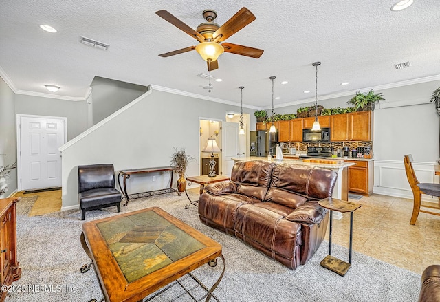 living room with ornamental molding and visible vents