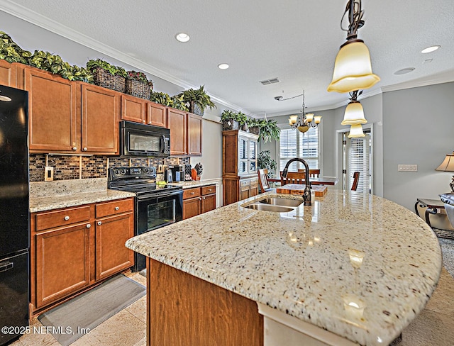 kitchen with tasteful backsplash, visible vents, ornamental molding, a sink, and black appliances