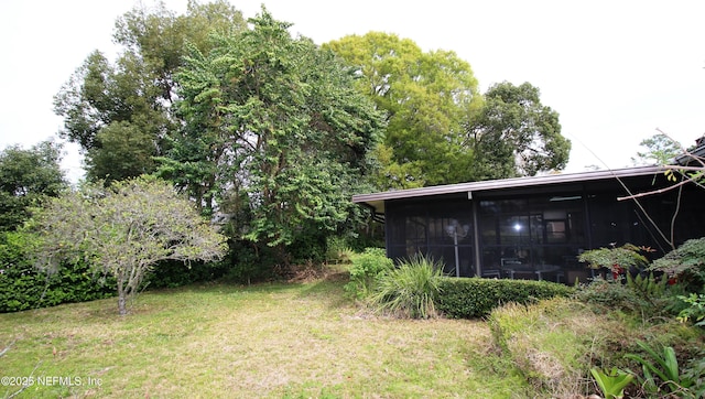 view of yard with a sunroom