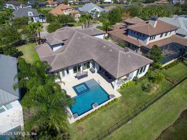 birds eye view of property with a residential view