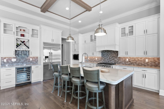 kitchen with wine cooler, white cabinetry, dark wood-type flooring, and built in appliances