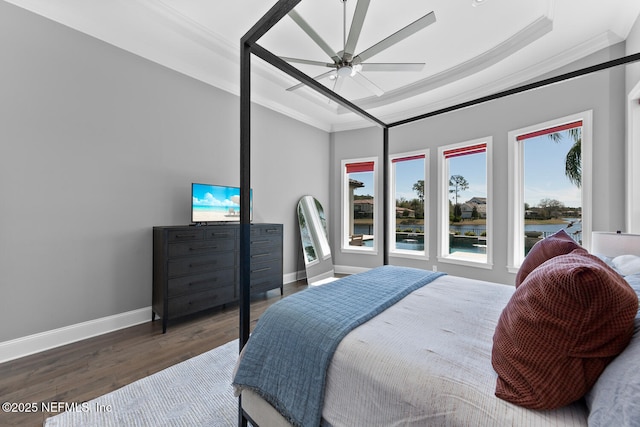 bedroom featuring crown molding, baseboards, and wood finished floors