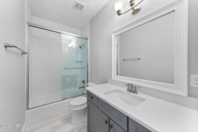 bathroom with visible vents, shower / bath combination with glass door, vanity, and toilet