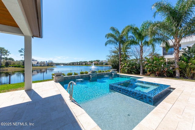 view of pool featuring a patio area, a water view, fence, and a pool with connected hot tub