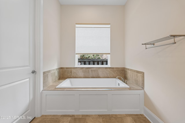 full bathroom featuring tile patterned flooring and a bath