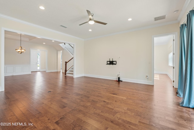 unfurnished living room with dark wood-type flooring, visible vents, and crown molding