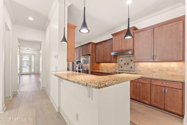 kitchen with ornamental molding, brown cabinets, light wood-type flooring, under cabinet range hood, and stainless steel refrigerator with ice dispenser