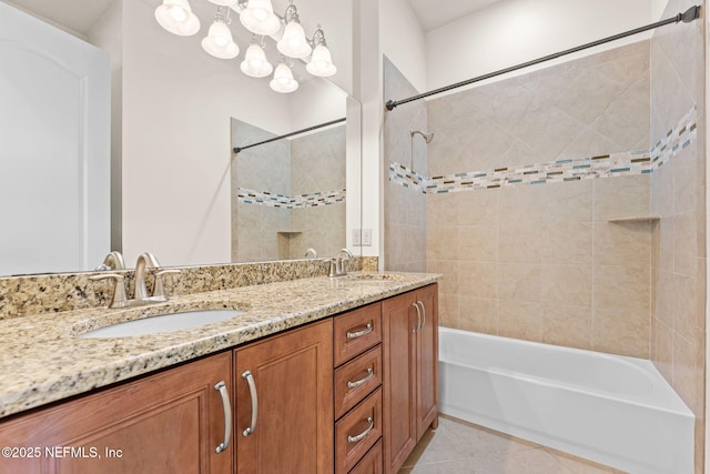 full bathroom with shower / bath combination, tile patterned flooring, double vanity, and a sink