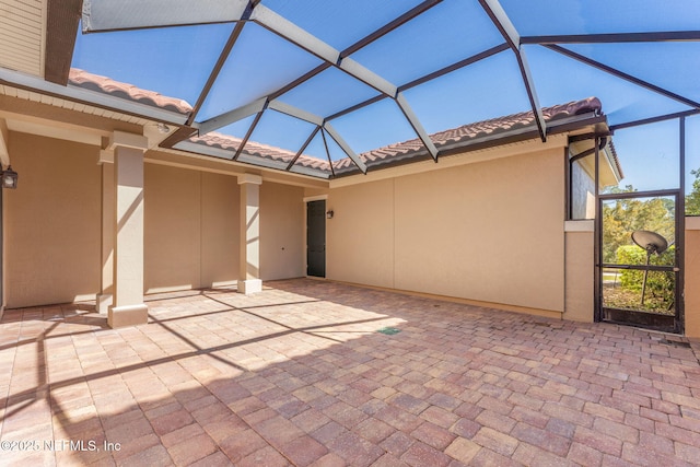 view of patio with a lanai