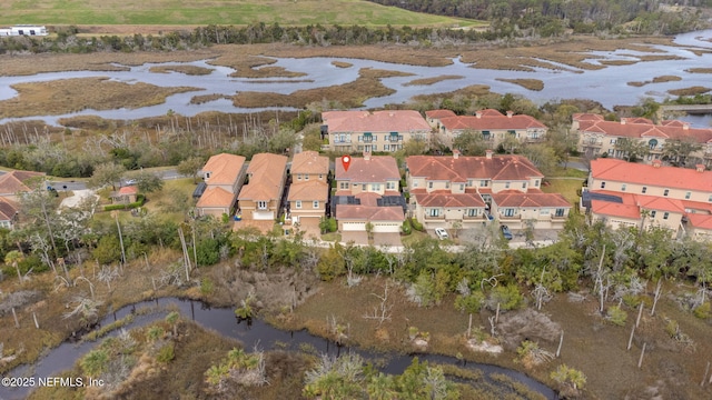 bird's eye view with a water view and a residential view