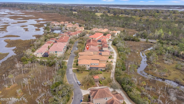 bird's eye view with a forest view and a residential view