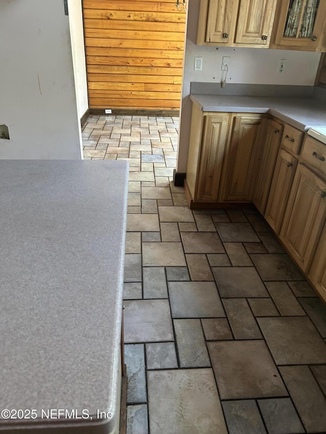 kitchen with brick floor and light countertops