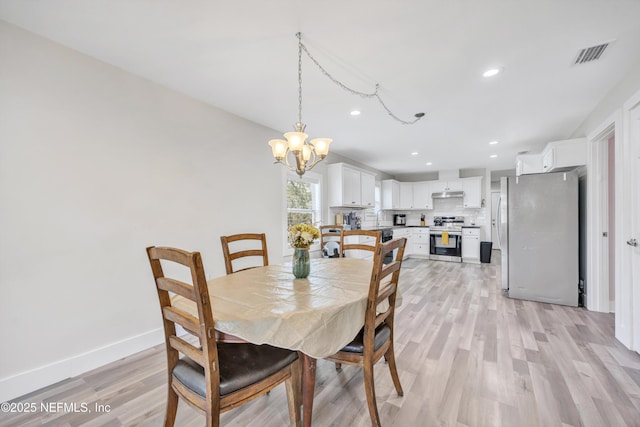 dining room featuring visible vents, baseboards, recessed lighting, light wood-style floors, and a notable chandelier