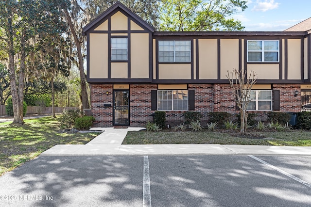 view of front of house with brick siding