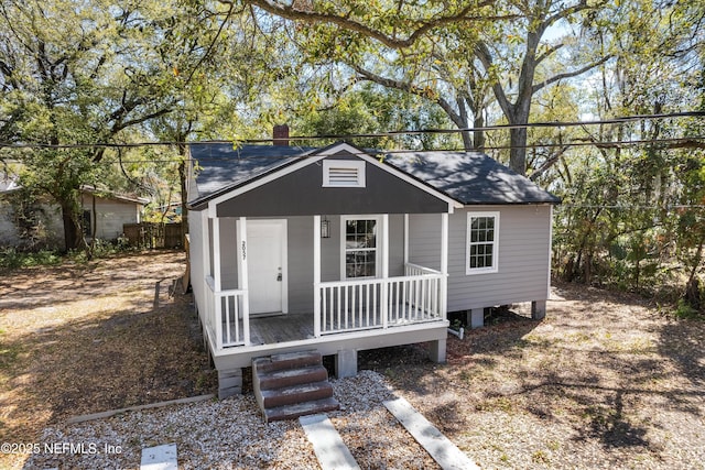 view of outbuilding with covered porch