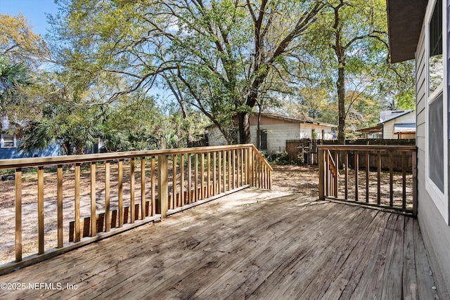 wooden deck featuring fence