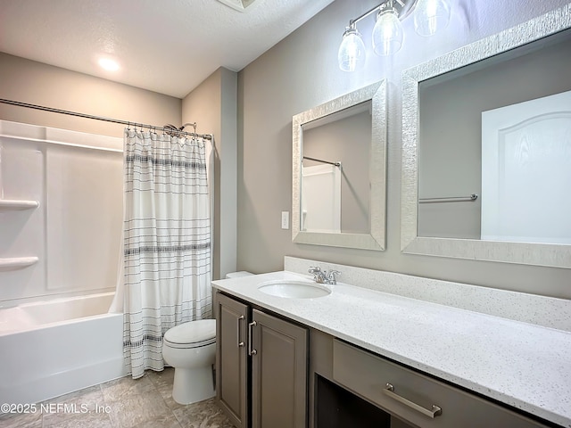 bathroom featuring a textured ceiling, shower / bath combination with curtain, vanity, and toilet