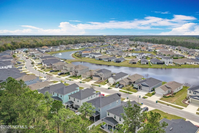 birds eye view of property with a residential view and a water view