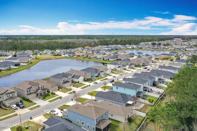 bird's eye view featuring a residential view and a water view