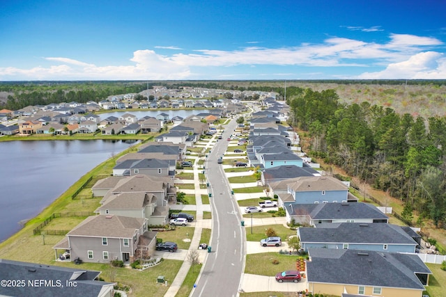 aerial view with a water view and a residential view