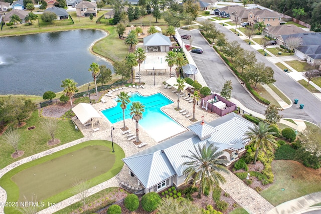 bird's eye view featuring a water view and a residential view