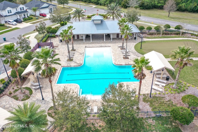 pool featuring stairs, a patio, and fence