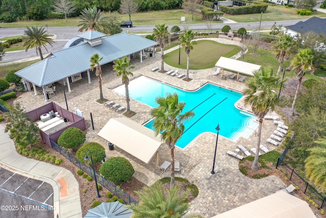 community pool featuring a patio, a gazebo, and fence