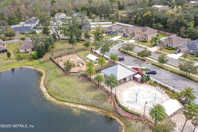 birds eye view of property featuring a water view and a residential view