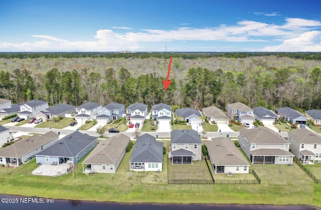 bird's eye view with a residential view and a view of trees