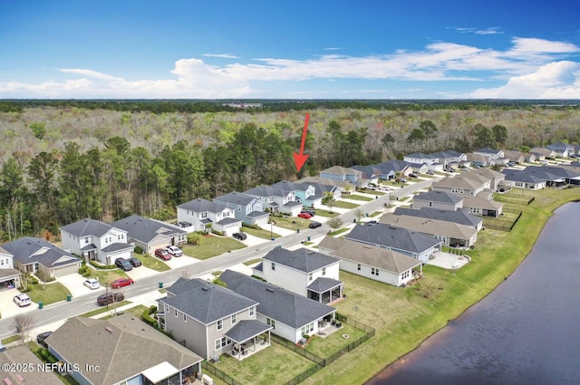 bird's eye view with a residential view, a water view, and a forest view