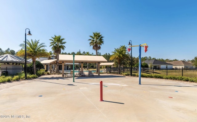 surrounding community with a gazebo and fence