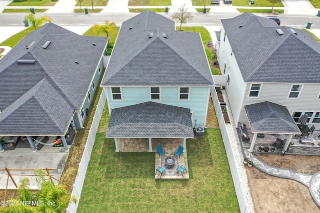 birds eye view of property with a residential view