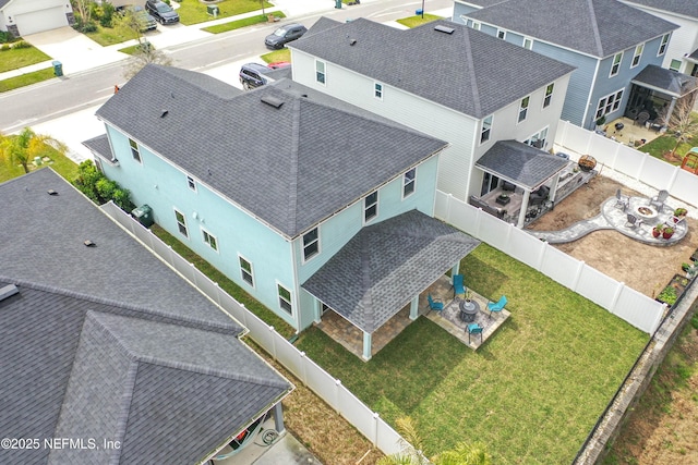 birds eye view of property with a residential view